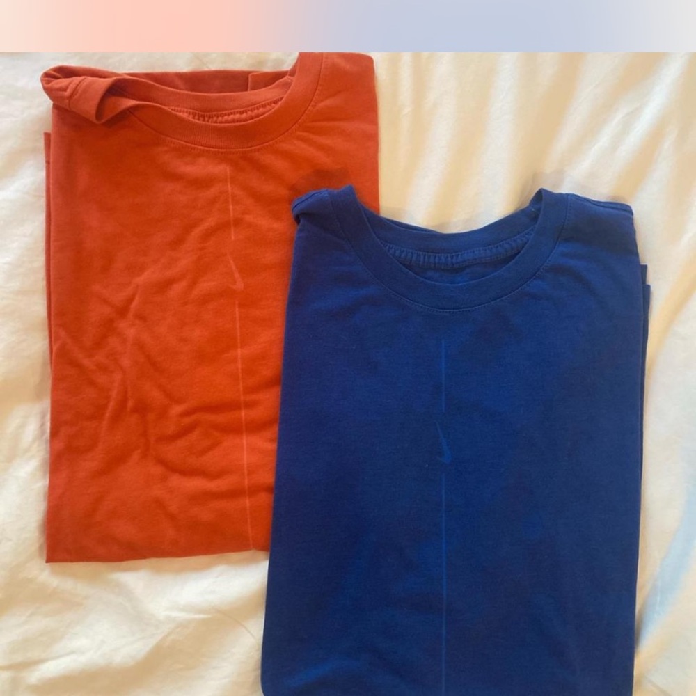 Two Men’s Nike tee size L.